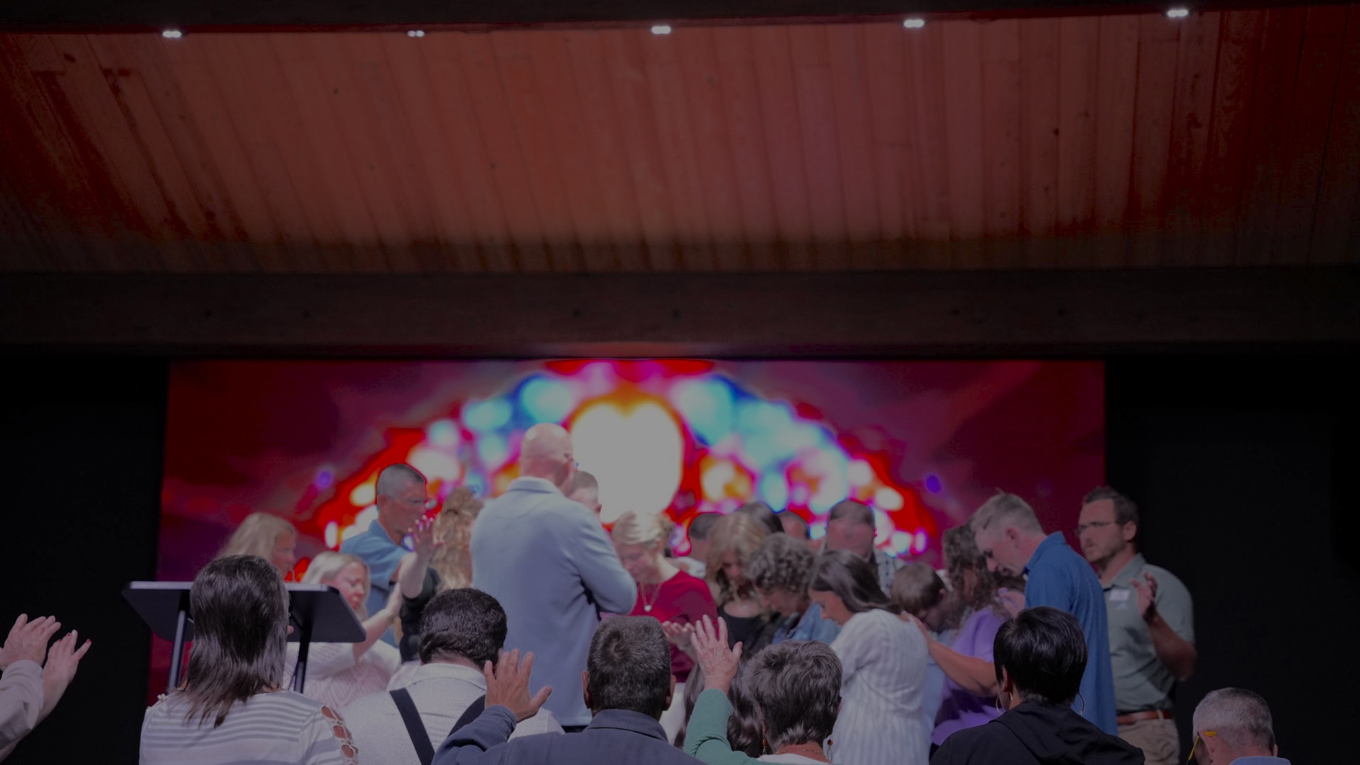People gathered at the front of the sanctuary in prayer