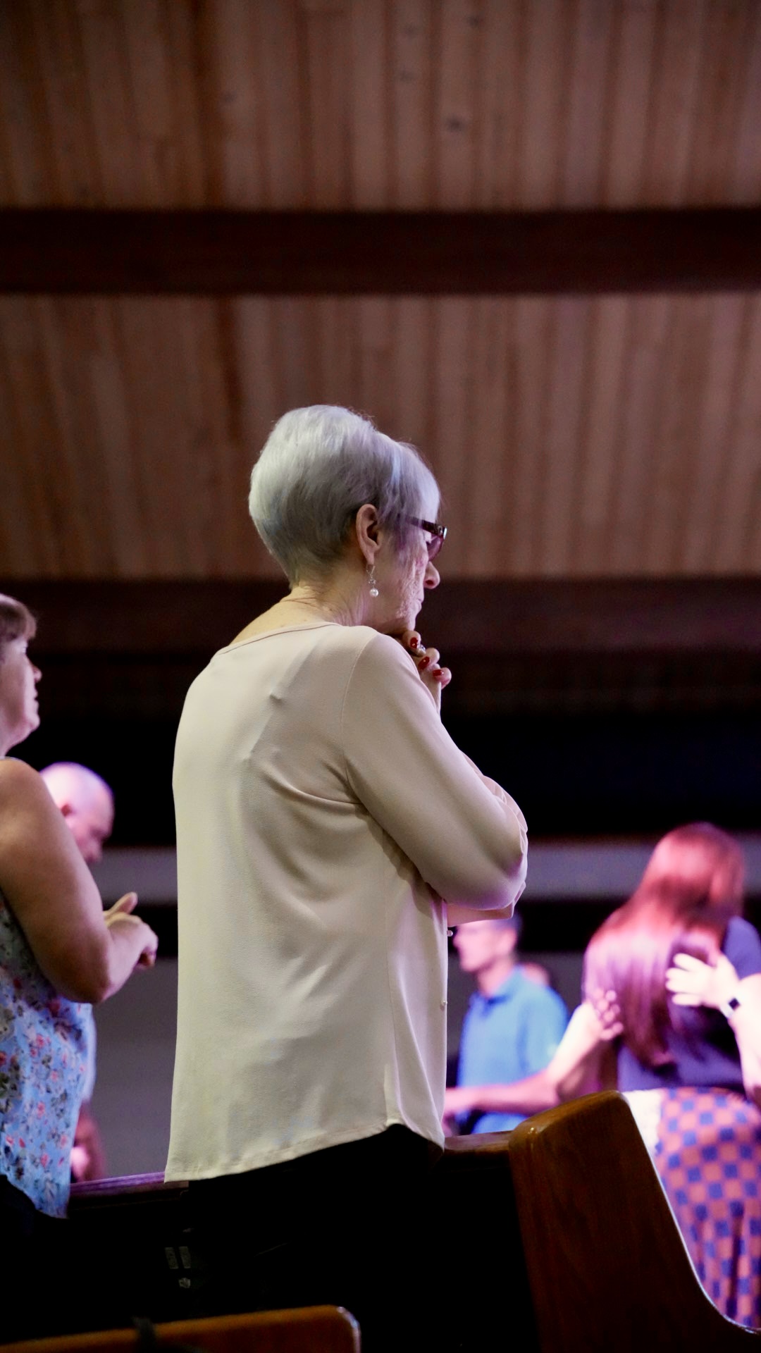 A woman in quiet reflection during the service