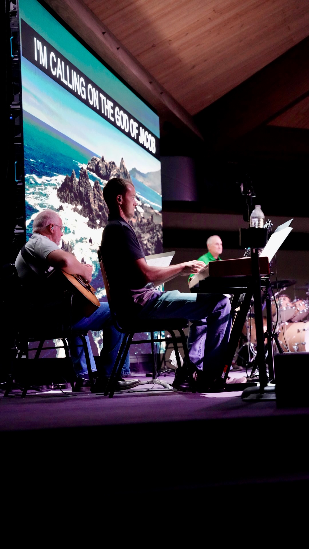 The worship band leading a song on stage