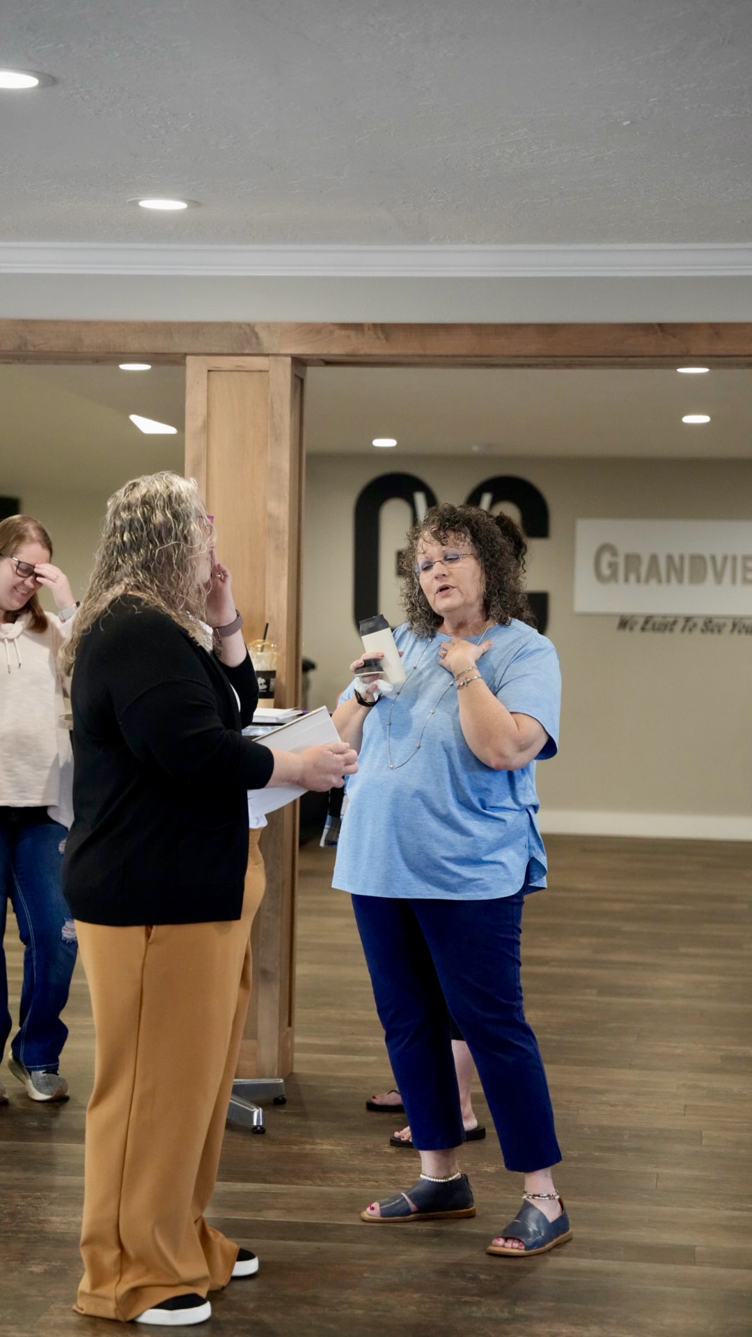 Church members visiting in the Grandview lobby