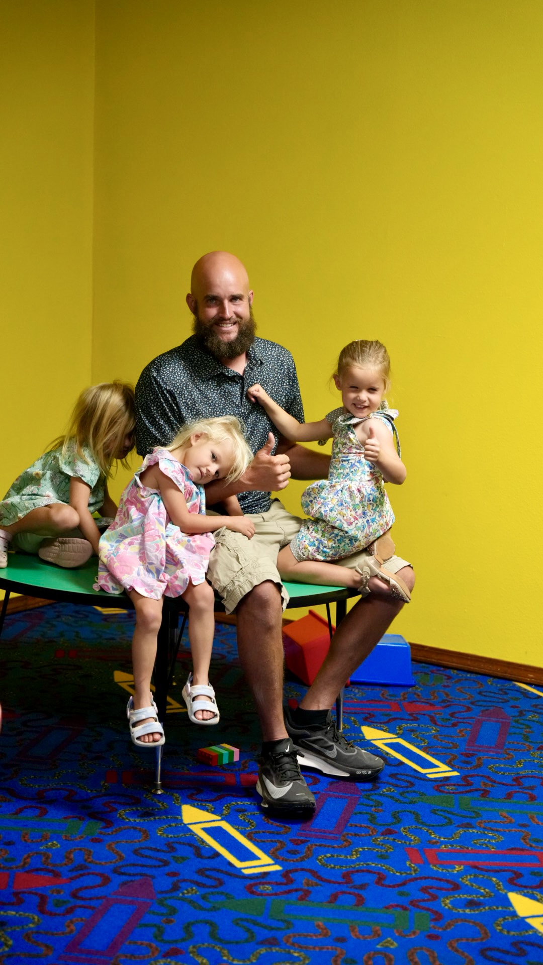 A kids ministry leader with children in the classroom
